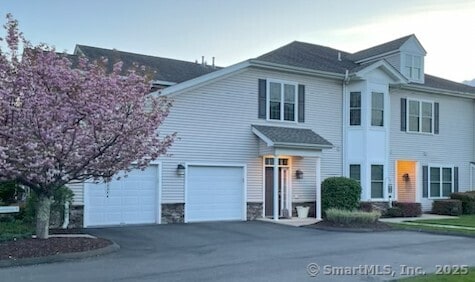 36 Todd St Unit 507, Hamden, CT 06518 - traditional-style house with an attached garage, driveway, and stone siding