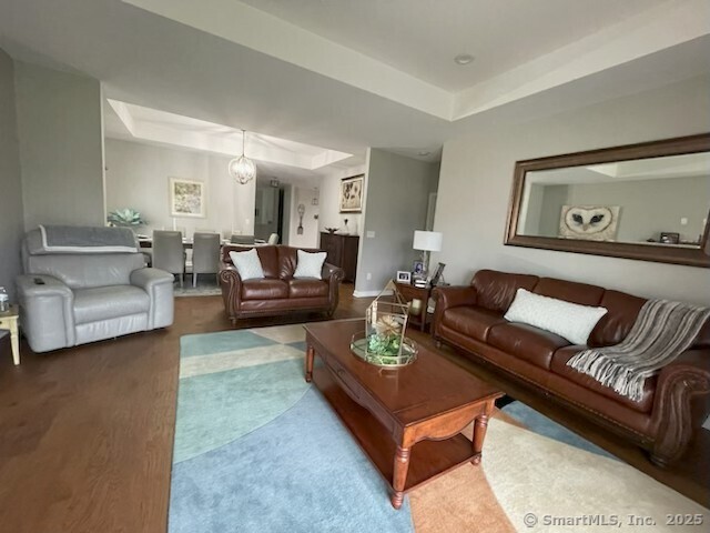 36 Todd St Unit 507, Hamden, CT 06518 - living area with a tray ceiling and carpet