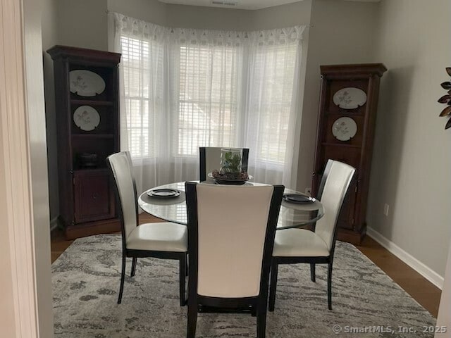 36 Todd St Unit 507, Hamden, CT 06518 - dining space with baseboards and wood finished floors