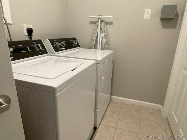 36 Todd St Unit 507, Hamden, CT 06518 - laundry area with washer and dryer and light tile patterned flooring