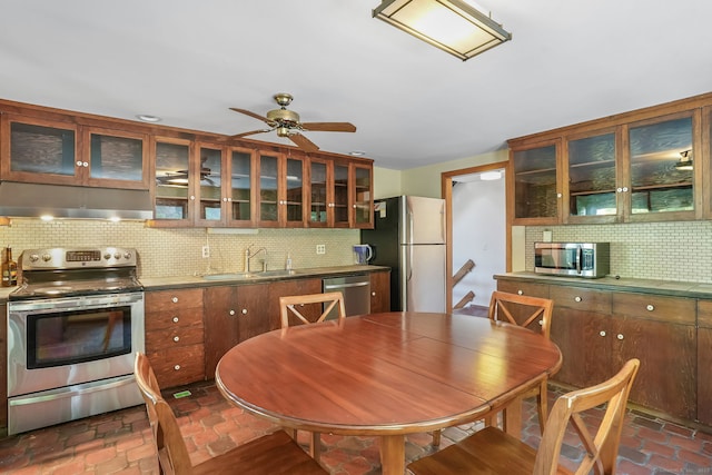 12 Sage Rd, Danbury, CT 06810 - kitchen with stainless steel appliances, under cabinet range hood, tasteful backsplash, glass insert cabinets, and ceiling fan