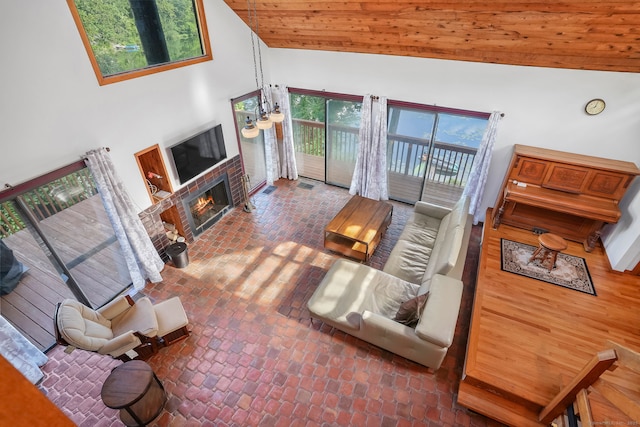 12 Sage Rd, Danbury, CT 06810 - living room with brick flooring, healthy amount of natural light, a brick fireplace, and high vaulted ceiling