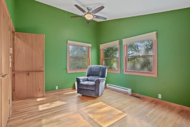 12 Sage Rd, Danbury, CT 06810 - living area with a baseboard heating unit, light wood-type flooring, and a ceiling fan