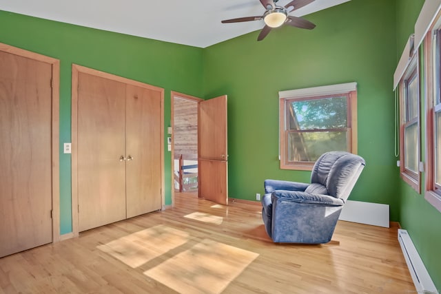 12 Sage Rd, Danbury, CT 06810 - sitting room featuring a baseboard radiator, wood finished floors, a ceiling fan, and lofted ceiling