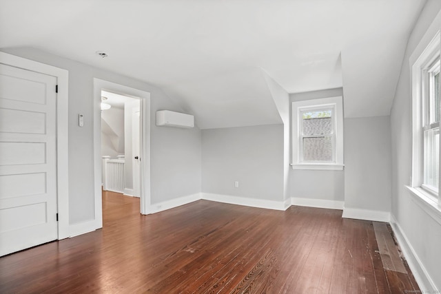 79 W Wooster St, Danbury, CT 06810 - additional living space featuring an AC wall unit, dark wood-style flooring, and vaulted ceiling