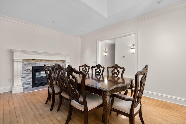 274 Sharon Tpke, Goshen, CT 06756 - dining area with light wood-style floors, ornamental molding, and a fireplace