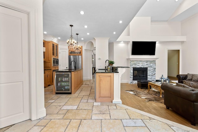 274 Sharon Tpke, Goshen, CT 06756 - kitchen featuring open floor plan, beverage cooler, stone tile flooring, dark countertops, and stainless steel appliances