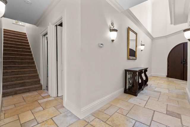 274 Sharon Tpke, Goshen, CT 06756 - entrance foyer with stone tile floors, stairway, crown molding, and arched walkways