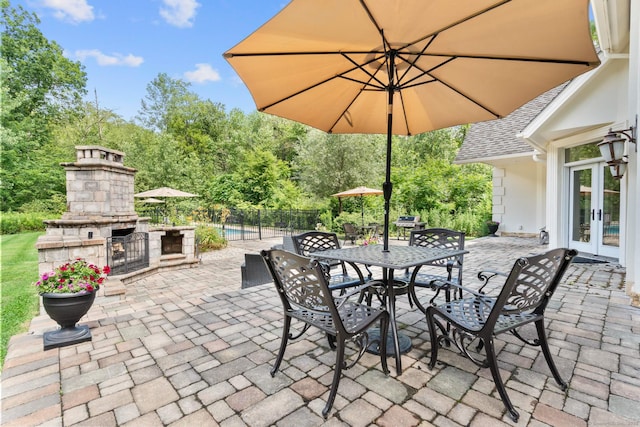 274 Sharon Tpke, Goshen, CT 06756 - view of patio / terrace featuring french doors and an outdoor stone fireplace