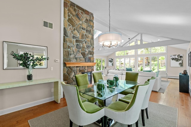 28 Codfish Ln, Weston, CT 06883 - dining room featuring wood finished floors, a chandelier, beamed ceiling, and high vaulted ceiling