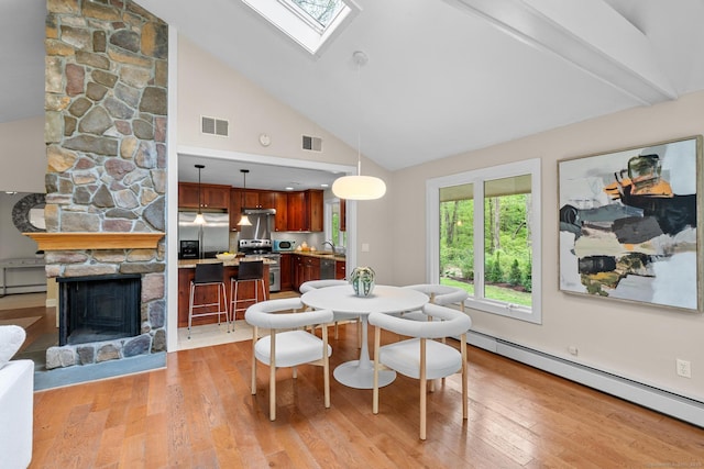 28 Codfish Ln, Weston, CT 06883 - dining room featuring a baseboard heating unit, a skylight, high vaulted ceiling, light wood-style flooring, and beamed ceiling