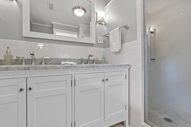 28 Codfish Ln, Weston, CT 06883 - bathroom with a shower stall, double vanity, and tile walls