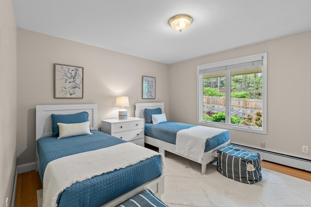 28 Codfish Ln, Weston, CT 06883 - bedroom featuring wood finished floors and a baseboard radiator