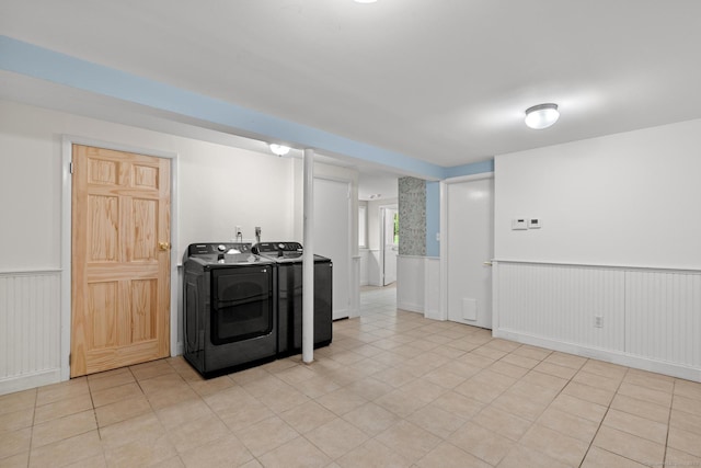 28 Codfish Ln, Weston, CT 06883 - kitchen featuring washing machine and clothes dryer, wainscoting, and light tile patterned floors