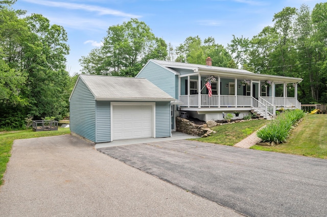 845 Five Mile River Rd, Putnam, CT 06260 - view of front facade with a porch, a chimney, and asphalt driveway