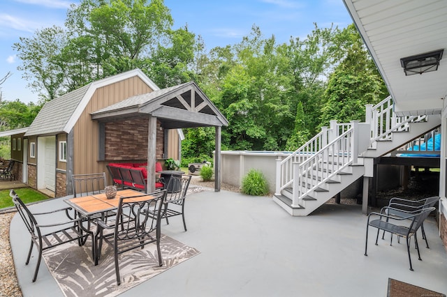 845 Five Mile River Rd, Putnam, CT 06260 - view of patio / terrace with stairs, view of wooded area, and outdoor dining space