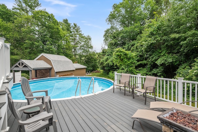 845 Five Mile River Rd, Putnam, CT 06260 - view of pool featuring a wooden deck, view of scattered trees, and an outdoor structure