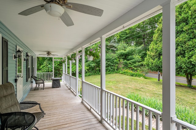 845 Five Mile River Rd, Putnam, CT 06260 - wooden porch featuring a ceiling fan and a yard