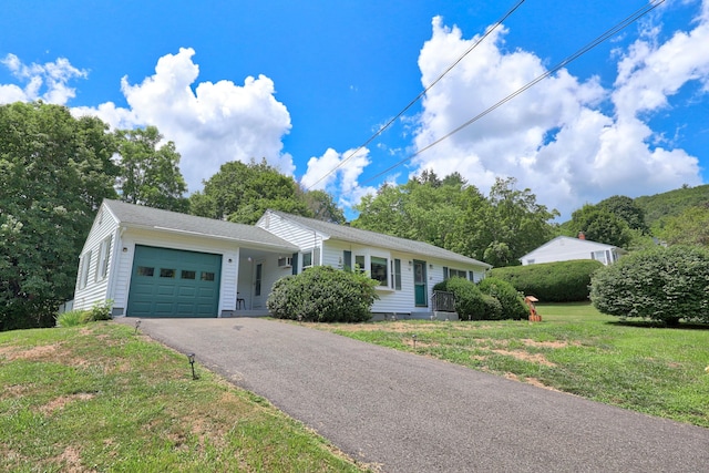 97 Edgewood Ave, Thomaston, CT 06787 - single story home with an attached garage, asphalt driveway, and a front yard