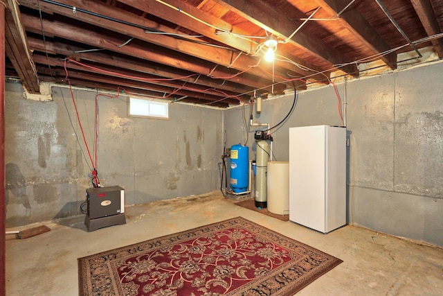 97 Edgewood Ave, Thomaston, CT 06787 - below grade area featuring a water pressure tank and freestanding refrigerator