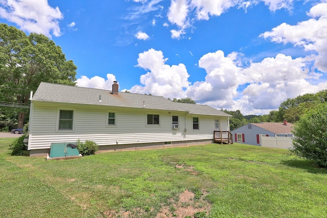 97 Edgewood Ave, Thomaston, CT 06787 - back of house with a lawn and a chimney