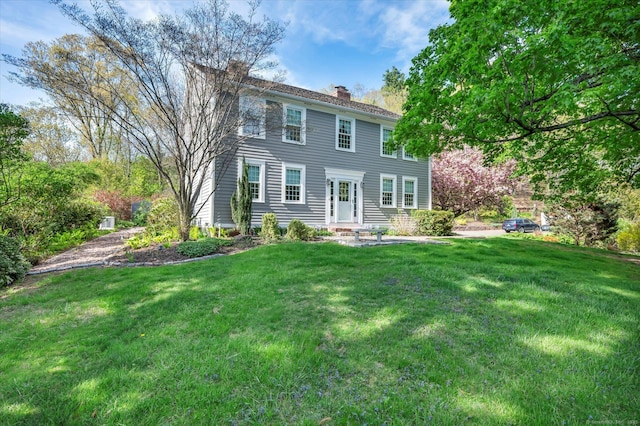 122 Nooks Hill Rd, Cromwell, CT 06416 - colonial-style house featuring a chimney and a front yard