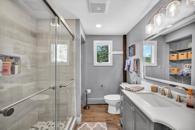 122 Nooks Hill Rd, Cromwell, CT 06416 - bathroom featuring vanity, a shower stall, and wood finished floors