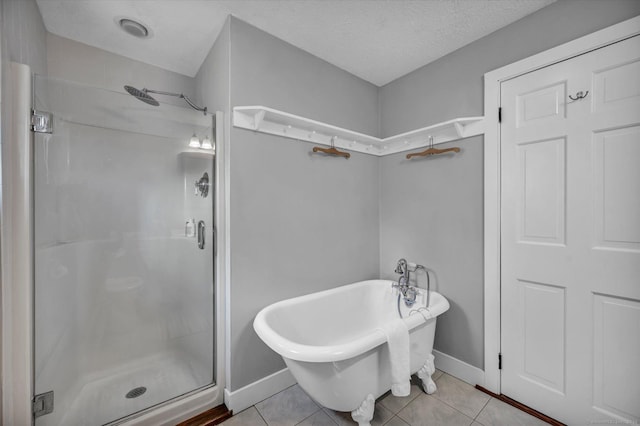 122 Nooks Hill Rd, Cromwell, CT 06416 - bathroom featuring a shower stall, tile patterned floors, a soaking tub, and a textured ceiling