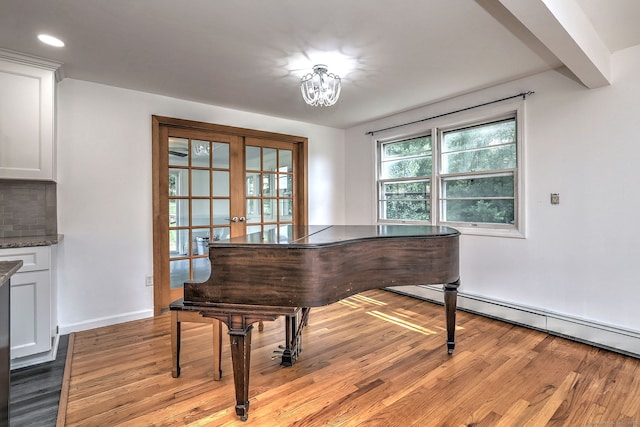 43 Berner Ter, Milford, CT 06460 - sitting room with french doors, light wood-style floors, recessed lighting, and a baseboard heating unit