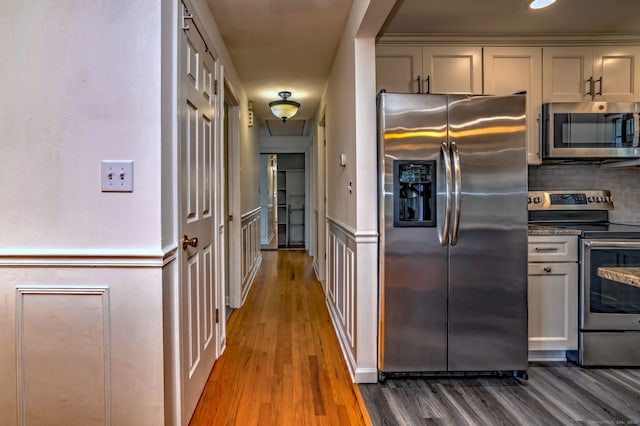 43 Berner Ter, Milford, CT 06460 - kitchen with stainless steel appliances, wood finished floors, and decorative backsplash