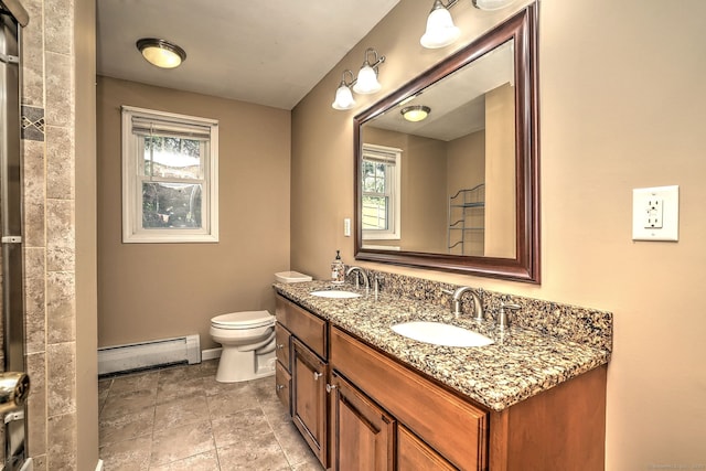 43 Berner Ter, Milford, CT 06460 - bathroom with baseboard heating, double vanity, and healthy amount of natural light