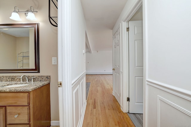 43 Berner Ter, Milford, CT 06460 - hall featuring a sink and light wood-style flooring