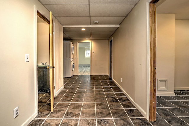 43 Berner Ter, Milford, CT 06460 - hallway featuring stacked washer and clothes dryer, a drop ceiling, recessed lighting, and tile patterned floors