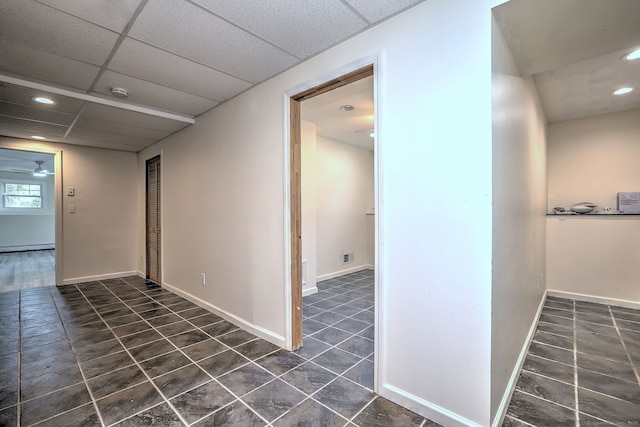 43 Berner Ter, Milford, CT 06460 - corridor featuring dark tile patterned floors, recessed lighting, a baseboard heating unit, and a drop ceiling