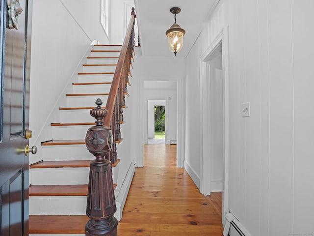 161 White St, Stratford, CT 06615 - foyer entrance with light wood-style floors, stairs, and a baseboard radiator