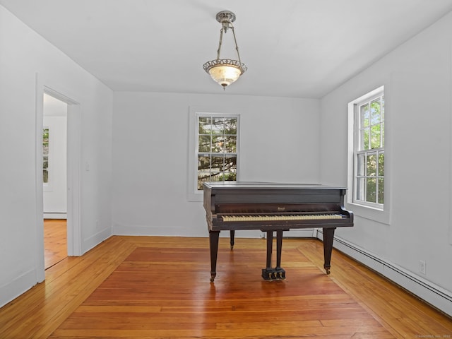 161 White St, Stratford, CT 06615 - sitting room with baseboard heating and light wood finished floors