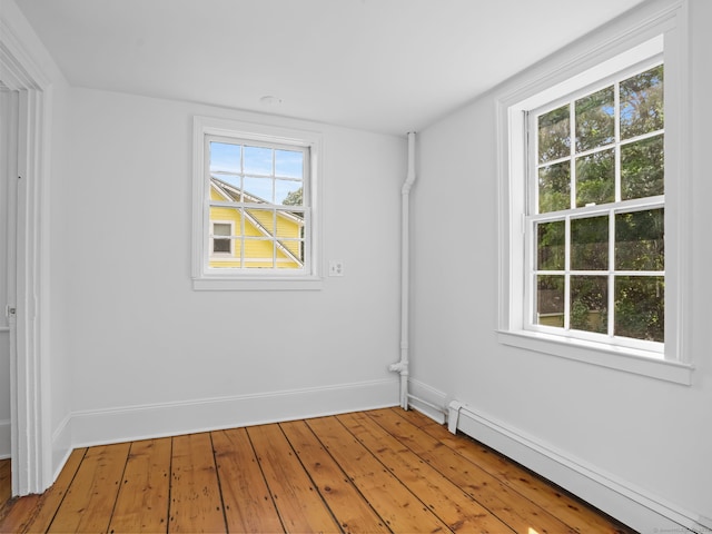 161 White St, Stratford, CT 06615 - spare room featuring a baseboard radiator and hardwood / wood-style flooring
