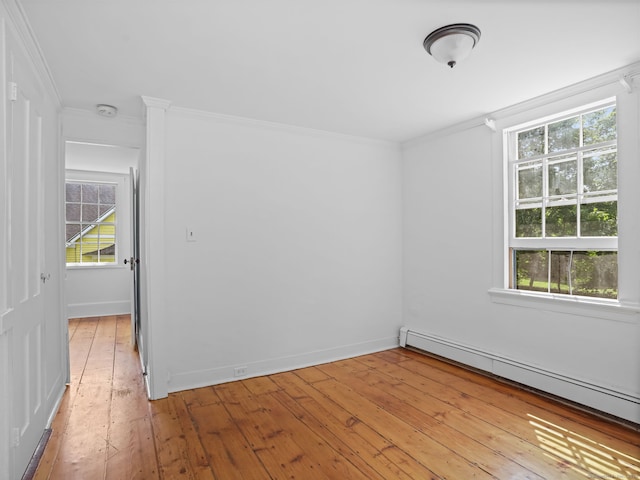 161 White St, Stratford, CT 06615 - empty room with a baseboard radiator, light wood finished floors, ornamental molding, and a smoke detector