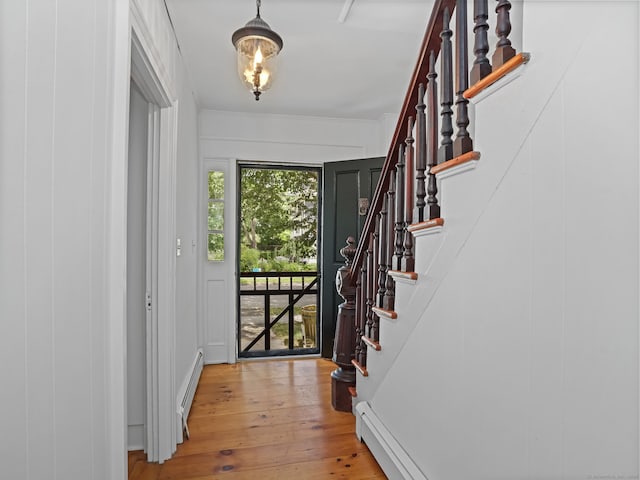 161 White St, Stratford, CT 06615 - entryway with stairway, light wood finished floors, crown molding, and a baseboard heating unit