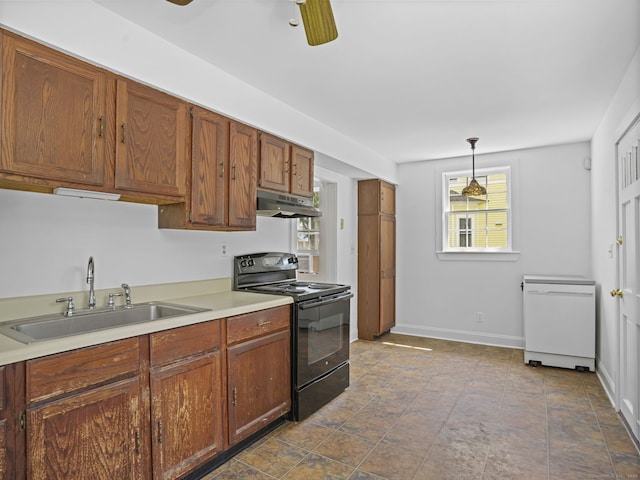 161 White St, Stratford, CT 06615 - kitchen featuring black / electric stove, under cabinet range hood, pendant lighting, light countertops, and brown cabinetry