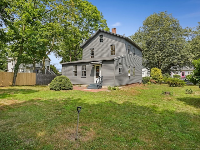 161 White St, Stratford, CT 06615 - rear view of house featuring a chimney