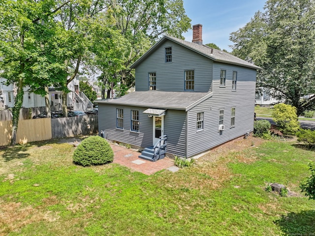 161 White St, Stratford, CT 06615 - back of house with a chimney and a shingled roof