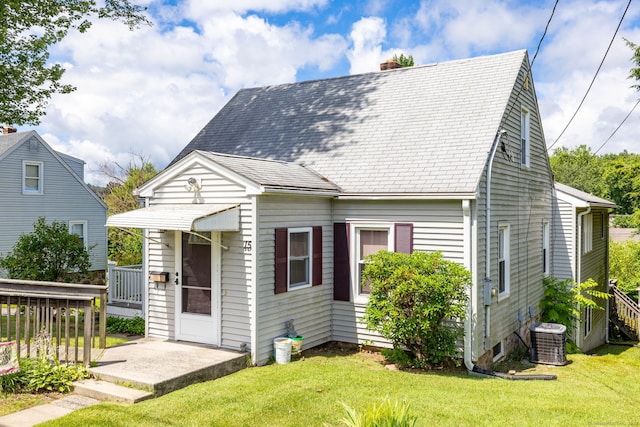 15 Boardman St, Bristol, CT 06010 - view of front of house featuring a front yard, a chimney, and a shingled roof