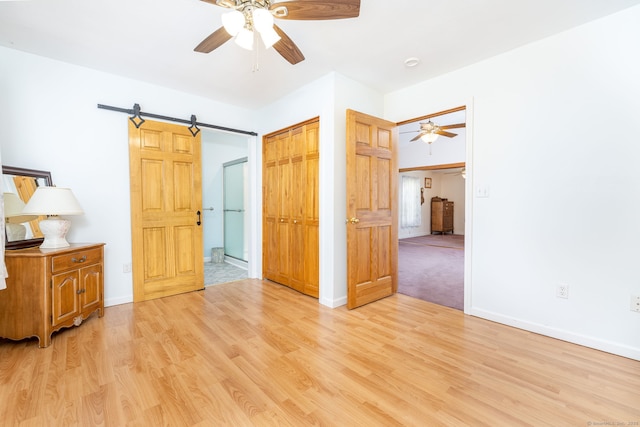 15 Boardman St, Bristol, CT 06010 - unfurnished bedroom featuring light wood-style flooring, a closet, a ceiling fan, and connected bathroom