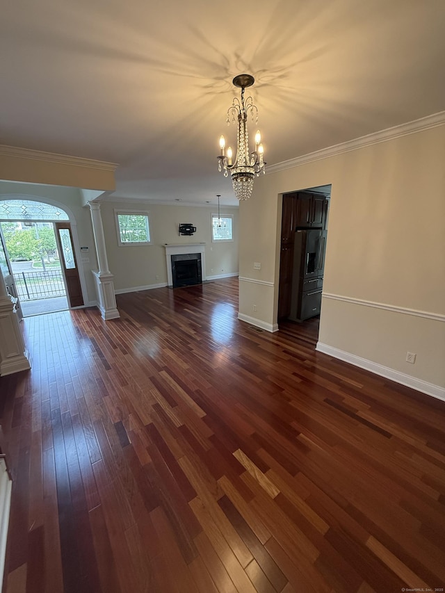 1 Sampson Ter Unit 801, Danbury, CT 06810 - unfurnished living room with dark wood-style flooring, decorative columns, a chandelier, a fireplace, and ornamental molding