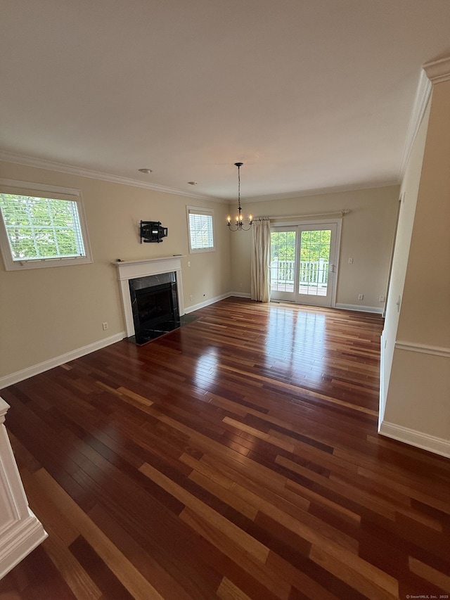 1 Sampson Ter Unit 801, Danbury, CT 06810 - unfurnished living room featuring a fireplace, wood-type flooring, crown molding, and a chandelier