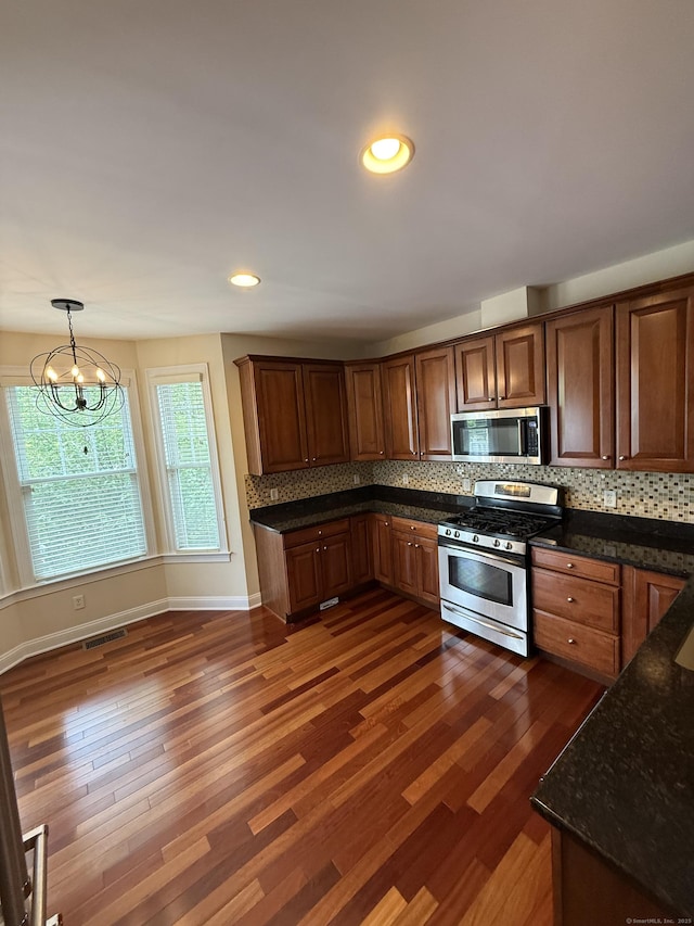 1 Sampson Ter Unit 801, Danbury, CT 06810 - kitchen featuring appliances with stainless steel finishes, decorative backsplash, dark wood-style floors, pendant lighting, and recessed lighting