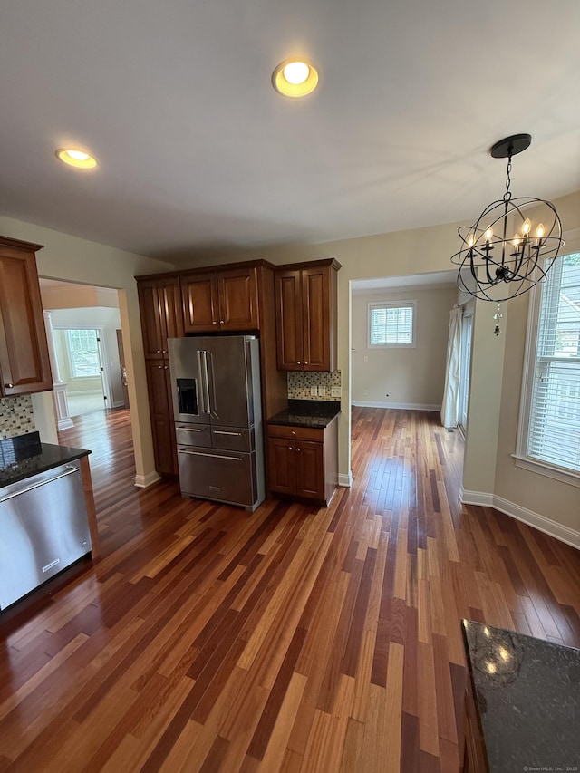 1 Sampson Ter Unit 801, Danbury, CT 06810 - kitchen featuring stainless steel appliances, decorative backsplash, dark wood-style floors, a chandelier, and recessed lighting