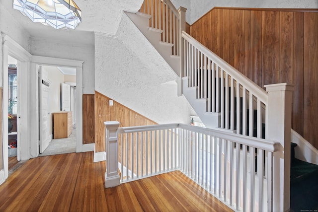 103 Eaton St, Bridgeport, CT 06604 - stairs featuring hardwood / wood-style floors and wood walls
