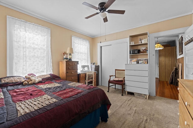 103 Eaton St, Bridgeport, CT 06604 - carpeted bedroom featuring ornamental molding, a closet, and a ceiling fan